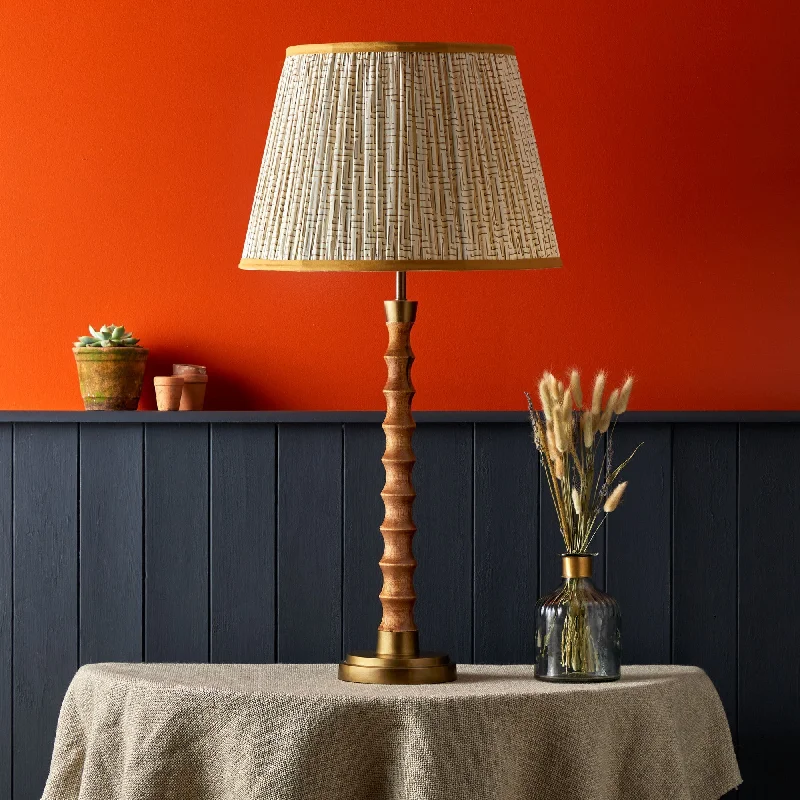 metal table lamps with a matte black finish for a sleek appearanceTinto table lamp in natural wood and antique brass